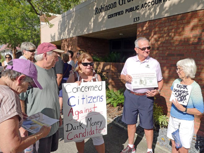 From left, Barbara Desmond, Jeff Halperin, Deb Schyvinck, Steve Hefer and Peg Magee attended a demonstration Monday afternoon against PAC money expenditures in the city of Venice. [HERALD-TRIBUNE STAFF PHOTO / EARLE KIMEL]