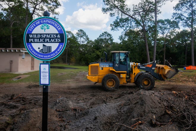 Construction is underway Monday at Northside Park at 5601 NW 34th Blvd. in Gainesville. The park, adjacent to the Senior Recreation Center, is on track to have 40 new parking spaces and an all-ages playground. The renovation also includes a new walking path, pavilion, shaded seats and outdoor exercise equipment. [Chris Day/Correspondent]