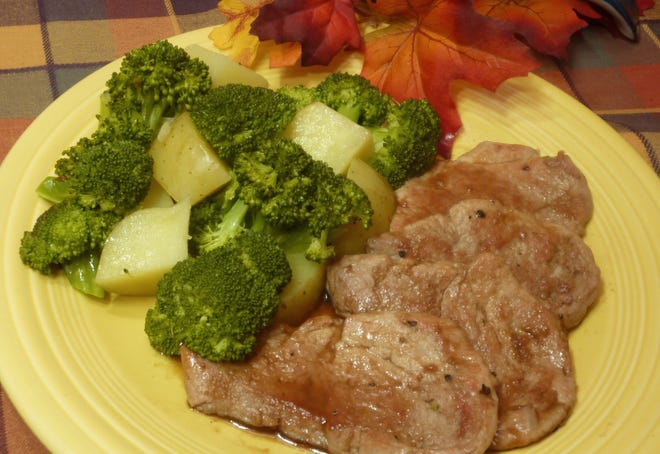 These Glazed Pork Medallions, with yellow potatoes and broccoli feature the flavors of sweet maple syrup, spicy mustard and tart balsamic vinegar. [Linda Gassenheimer/TNS]