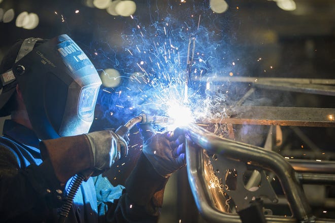 A worker welds the frame for the 2016 Wildcat X side-by-side vehicle in 2015 at the Arctic Cat factory in Thief River Falls, MN. (Leila Navidi / Star Tribune / TNS)