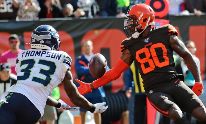Seattle Seahawks free safety Tedric Thompson (33) intercepts pass for Cleveland Browns wide receiver Jarvis Landry (80) in the end zone during the first half of an NFL football game, Sunday, Oct. 13, 2019, in Cleveland. (AP Photo/Ron Schwane)