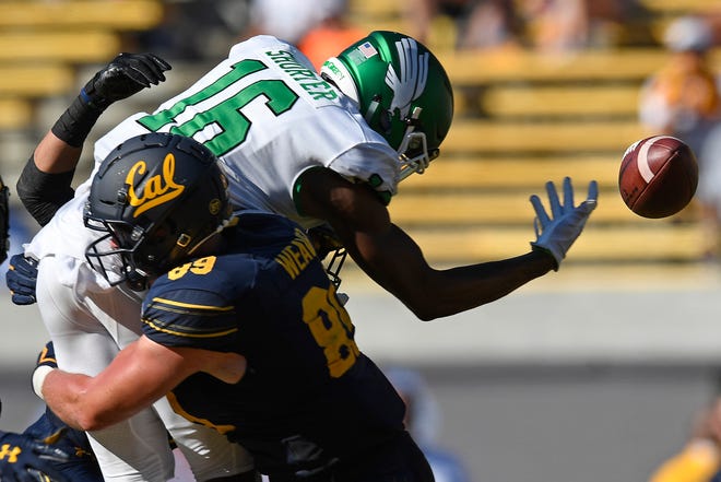 FILE - In this Sept. 14, 2019, file photo, California's Evan Weaver (89) tackles North Texas' Jyaire Shorter (16) while attempting to catch a pass on fourth down in the fourth quarter of on NCAA college football game, in Berkeley, Calif. Weaver was selected to the AP Midseason All-America NCAA college football team, Tuesday, Oct. 15, 2019. (Jose Carlos Fajardo/San Jose Mercury News via AP, File)