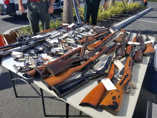 The Volusia County Sheriff’s Office displays firearms deputies collected in the 2018 Kicks for Guns event. Unwanted firearms were exchanged for a $50 gift card. [Volusia County Sheriff’s Office]