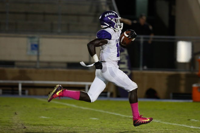 Fletcher's Myles Montgomery runs for a touchdown against Buchholz. The Senators running back leads the area in rushing yards. [Chris Day/Gainesville Sun Correspondent]