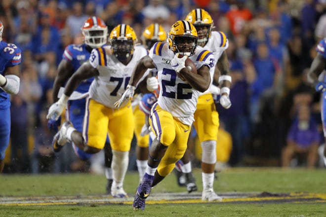 LSU running back Clyde Edwards-Helaire (22) carries for 57 yards in the first half Saturday against Florida in Baton Rouge, La. [Gerald Herbert/The Associated Press]