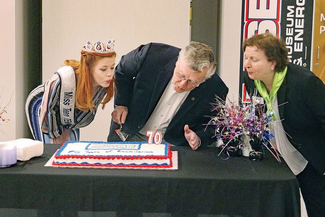 Miss Teen Tennessee Victoria Berry, an Oak Ridge High School student, from left, city of Oak Ridge historian D. Ray Smith and AMSE director Julia Bussinger blow out the candles on a special birthday cake at AMSE earlier this year. The American Museum of Science and Energy held a public celebration to commemorate March 19, 1949 — when the gates of the once 'Secret City' and the nation's first atomic energy museum opened.