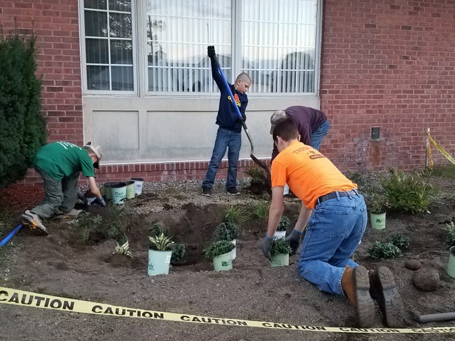 Cub Scouts help create a rain garden in front of Griswold Town Hall. [Town of Griswold/contributed]