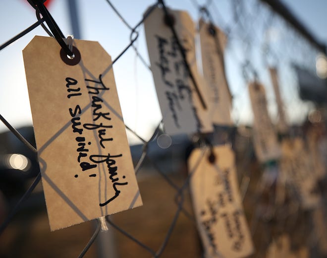 Hand written messages on tags hang from the "Gate of Gratitude" where community members expressed their thanks to those who helped out with the aftermath of Hurricane Michael. Hundreds attended the Mexico Beach "One Year Later" community event to remember the local impact of Hurricane Michael and celebrate local resilience on Oct.10, 2019. [PATTI BLAKE/THE NEWS HERALD]