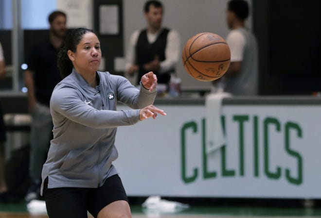 Boston Celtics assistant coach Kara Lawson passes the ball at the team's training facility in Boston. Celtics guard Gordon Hayward said Lawson has already made her presence felt. [CHARLES KRUPA/THE ASSOCIATED PRESS]