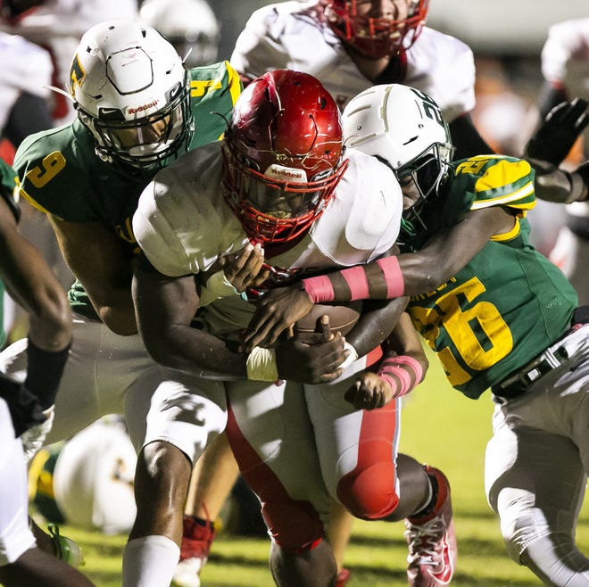 Santa Fe High School Darrius Powell (5) barrels his way into the end zone for a touchdown in the third quarter to make it 14-0 after the extra point. The Forest Wildcats hosted the Santa Fe Raiders Thursday night, October 17, 2019 at Forest High School in Ocala, FL. [Doug Engle/Ocala Star-Banner]2019
