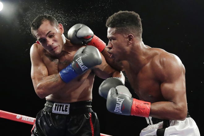 In this Oct. 27, 2018, file photo, Patrick Day, right, punches Elvin Ayala during the fifth round of a WBC super welterweight boxing bout in New York. Day won the fight. Day died Wednesday, four days after sustaining head injuries in a fight with Charles Conwell. Promoter Lou DiBella said Day died at Northwestern Memorial Hospital. He was 27. [FRANK FRANKLIN II/ASSOCIATED PRESS]