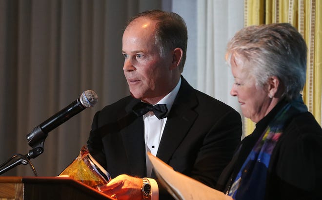 Bill Carstarphen, CEO of Pharr Yarns, receives the Spirit of the Carolinas Award during the 17th annual Salute to Business & Manufacturing, which was held Thursday evening at the Gaston Country Club. [Mike Hensdill/The Gaston Gazette]