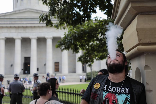 A man exhales while vaping following a vaping advocates rally on Tuesday, October 1, 2019 at the Ohio Statehouse in Columbus, Ohio. (Joshua A. Bickel/The Columbus Dispatch/TNS)