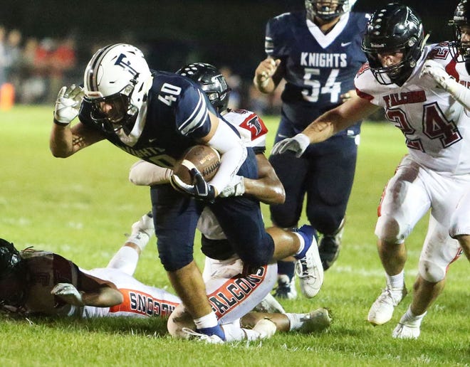 Fieldcrest running back Kenton Castrejon runs the ball during a game this season against Gibson City-Melvin-Sibley. The Knights remain No. 1 statewide in Class 2A. [COURTESY MARK AND TERRI TAYLOR]