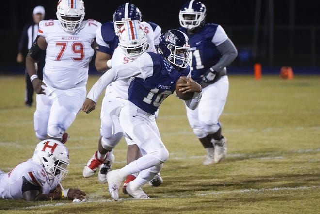 Paul Bryant‡ïs Ty‡ïJavian Edwards (10) carries the ball at an AHSAA football game between Hillcrest and Bryant at Bryant High School in Tuscaloosa, Ala. on Friday, Oct. 18, 2019. [Photo/Jake Arthur]