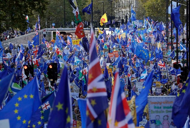 Anti-Brexit remain in the European Union supporters take part in a "People's Vote" protest march calling for another referendum on Britain's EU membership, in London, Saturday, Oct. 19, 2019. Britain's Parliament is set to vote in a rare Saturday sitting on Prime Minister Boris Johnson's new deal with the European Union, a decisive moment in the prolonged bid to end the Brexit stalemate. Various scenarios may be put in motion by the vote.