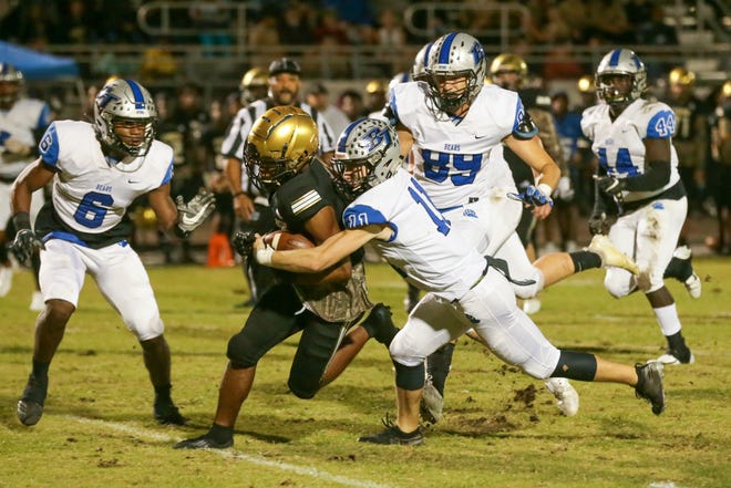 Bartram Trail safety Zakk Morse (11) tackles an Oakleaf player during the first half of an Oct. 18, 2019 football game. The Bears used 14 fourth-quarter points to win 31-24. [Will Brown/The Record]