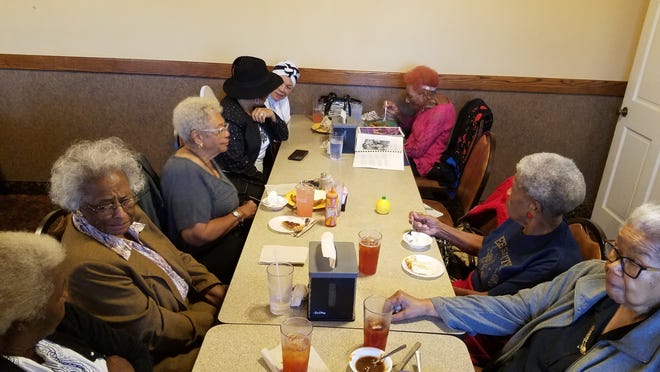 Members of the class of 1952 at E.E. Smith High School meet for lunch on third Thursdays. On Thursday, Oct. 17, 2019, they met at the Sandpiper Seafood Restaurant on Eastern Boulevard. From left, counter-clockwise, they are Josephine McSwain Coleman-Smith, Maxine Ramseur Andrews-McCall, Sylvia Smith Williams, Johnsie Parker Burgess, Ora White Aney, Mary Gerald Walker, Rachel McKelvin Ellis and Ethelyn Holden Baker. [Photo/Myron B. Pitts/The Fayetteville Observer]