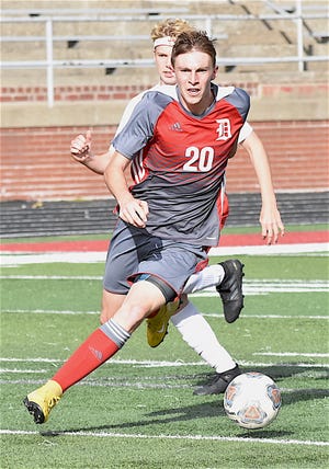 Dover's Devon Swiger moves downfield during the Division II boys sectional soccer title game against Minerva on Saturday. GateHouse Media Ohio/Todd Reed