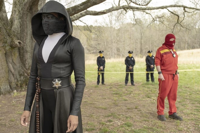 Regina King, left, appears in a scene from "Watchmen" [Mark Hill/HBO]