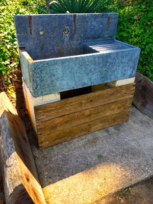 This stunning outdoor sink is made from natural stone. Polishing will restore its shine, and special sealers should be used to preserve it. [TRIBUNE CONTENT AGENCY]