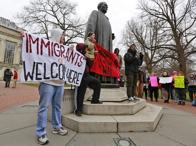 Students at Ohio State University protest President Donald Trump's immigration policies in front of the Thompson Library in 2017. A decline in enrollment of international students at colleges and universities in Ohio and nationwide has been attributed in part to the political climate created by the Trump administration. [Barbara J. Perenic/Dispatch file photo]