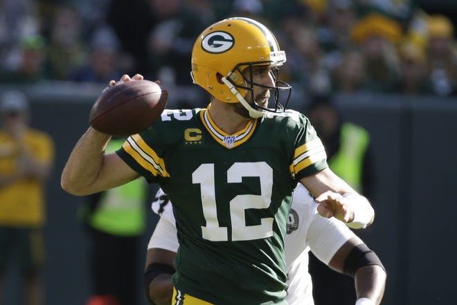 Green Bay Packers' Aaron Rodgers throws during the second half of an NFL football game against the Oakland Raiders Sunday, Oct. 20, 2019, in Green Bay, Wis. (AP Photo/Mike Roemer)