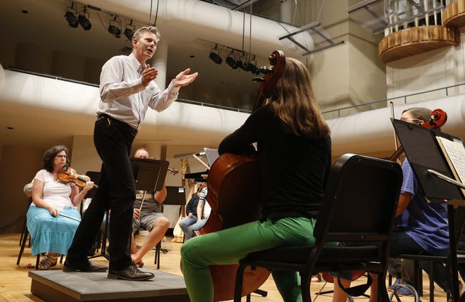 Director Adam Flatt gives instructions during rehearsal for the Tuscaloosa Symphony Orchestra Sunday, Sept. 16, 2018, in Moody Music Hall at the University of Alabama. [Staff file photo/Gary Cosby Jr.]