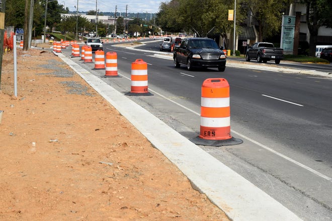 The one-percent Transportation Investment Act sales tax helped fund ongoing road, median and sidewalk work along 15th Street in Augusta seen here Monday. Voters are expected to see renewing the 10-year tax on the March Presidential Preference Primary ballot. [MICHAEL HOLAHAN/THE AUGUSTA CHRONICLE]