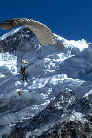 Military freefall requires a parachute that can handle not just the weight of a jumper but also a lot of heavy equipment. This photograph was taken in the Himalayas near Mount Everest in 2017, as part of an expedition led by Complete Parachute Solutions, a DeLand company that provides chutes to the Department of Defense and other clients. [CPS]