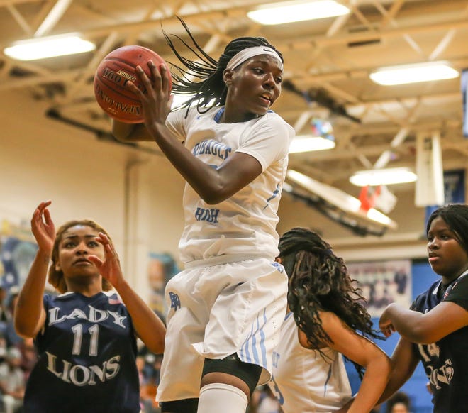 Ribault's Rennia Davis (10) grabs a defensive rebound against Potter's House during a 2016 game. Davis, now at the University of Tennessee, is the Times-Union's All-Decade player for girls basketball. [Gary Lloyd McCullough/For the Times-Union]