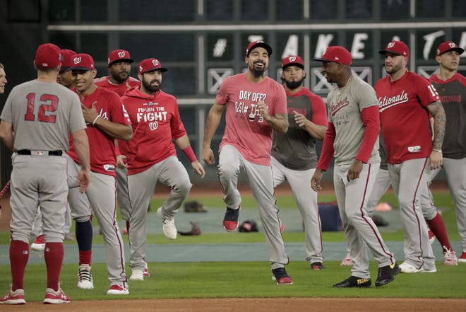 Washington Nationals third baseman Anthony Rendon, middle, warms up during batting practice Monday for the World Series in Houston. The Houston Astros face the Washington Nationals in Game 1 on Tuesday. [DAVID J. PHILLIP/THE ASSOCIATED PRESS]