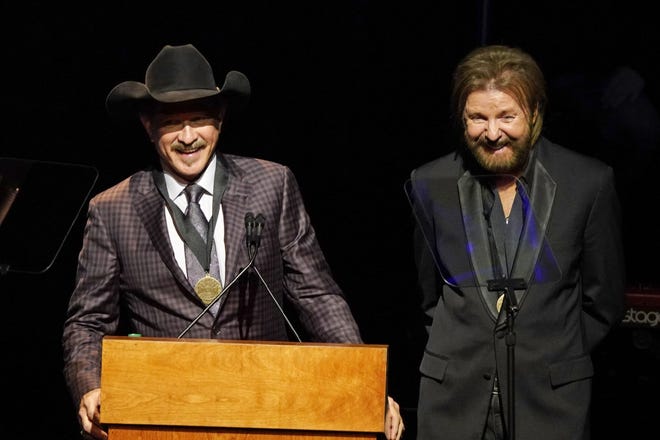 Kix Brooks, left, and Ronnie Dunn, right, speak after being inducted into the Country Music Hall of Fame Oct. 20 at 2019 Medallion Ceremony at the Country Music Hall of Fame and Museum in Nashville, Tenn. [The Associated Press]