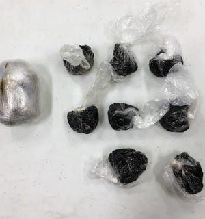 Seized heroin from an April warrant execution by the 12th and 21st District Drug Task Force is shown. [PHOTO COURTESY OF 12TH AND 21ST DISTRICT DRUG TASK FORCE]