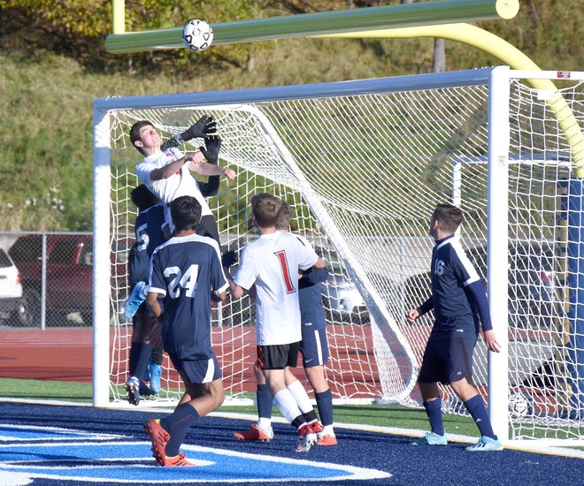 Lowville Academy's Jared Ortlieb goes up in front of Central Valley Academy's goalkeeper after a corner kick during the first half of Saturday's match. The Thunder successfully defended the play and led 1-0 at halftime on the way to a 2-1 victory. 

[Jon Rathbun / Times Telegram]
