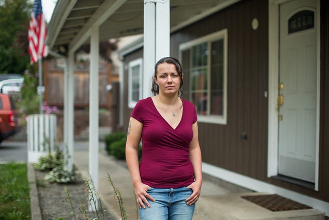 Ashley Pintos's debt for emergency care at St. Joseph Medical Center in Tacoma, Washington, was referred to a collection agency after she was unable to pay. She said she was not given a financial aid application form, even after asking. [DAN DeLONG / KAISER HEALTH NEWS]