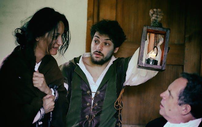 Boxford resident Noah Greenstein, center, plays the Gaoler (jailer) in Punctuate4's production of the new play, "Saltonstall's Trial," at the Larcom Theatre in Beverly. He is shown in this scene with Judge Nathaniel Saltonstall, played by Benjamin Evett, and Verjana Abazaj as Sarah Good. [Courtesy Photo/Mark Lorenz]
