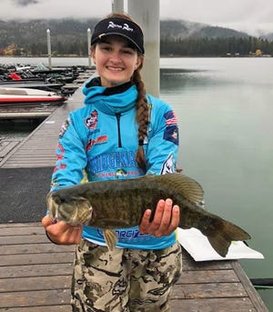 Bridgemaster Fishing Products Youth pro-staff angler Cricket Coates, 15, of Lake Wales shows her 3.24-pound smallmouth bass that garnered her fifth place in the Big Bass Junior Championship Nationals Tournament in Priest River, Idaho Saturday. [ PROVIDED BY CRICKET COATES ]