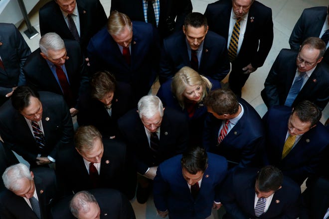 Rep. Debbie Lesko, R-Ariz., center, gathers with fellow House Republicans for a news conference after Deputy Assistant Secretary of Defense Laura Cooper arrived for a closed door meeting to testify as part of the House impeachment inquiry into President Donald Trump, Wednesday, Oct. 23, 2019, on Capitol Hill in Washington. (AP Photo/Patrick Semansky)