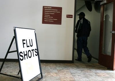 In this file photo, a sign indicates flu shots are available at the Sangamon County Department of Public Health. Health experts are warning this year's flu season could be harsh. [File/State Journal-Register]