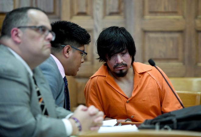 Juan Leon-Gomez, 26, with Barry Wakser, of the Stark County Public Defender´s Office (left) and interpreter Modesto Boton, of Cleveland, pleaded guilty Tuesday to the rape of an 11-year-old girl. Stark County Common Pleas Judge Frank Forchione sentenced Leon-Gomez to 10 years to life in prison. (GateHouse Media Ohio / Julie Vennitti, CantonRep.com)