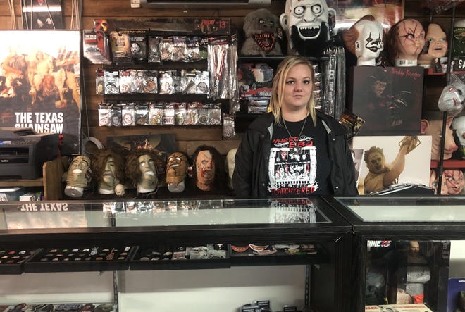 Jennifer Gross stands at the counter of The Gas Station, the iconic barbecue joint and memorabilia shop where scenes from the 1974 film "The Texas Chainsaw Massacre" were filmed. [Brandon Mulder/Bastrop Advertiser]