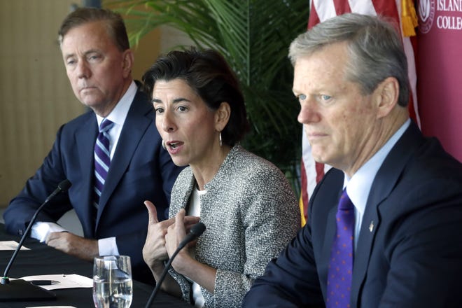 Rhode Island Gov. Gina Raimondo, center, speaks to the media between Connecticut Gov. Ned Lamont, left, and Massachusetts Gov. Charlie Baker, right, after a private meeting to discuss issues of regional importance, Thursday, Oct. 24, 2019, on the campus of Rhode Island College in Providence. [STEVEN SENNE/AP PHOTO]