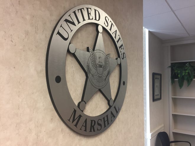 The U.S. Marshals emblem is seen in the organization's Western District of Arkansas office in Fort Smith. [TIMES RECORD FILE PHOTO]