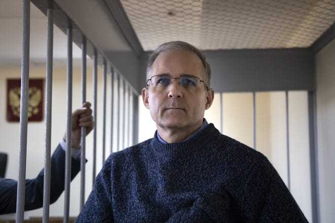 Paul Whelan of Novi, a former U.S. Marine who was arrested on an espionage charge in Moscow at the end of 2018, stands in a cage in a courtroom while waiting for a hearing Aug. 23 in Moscow.