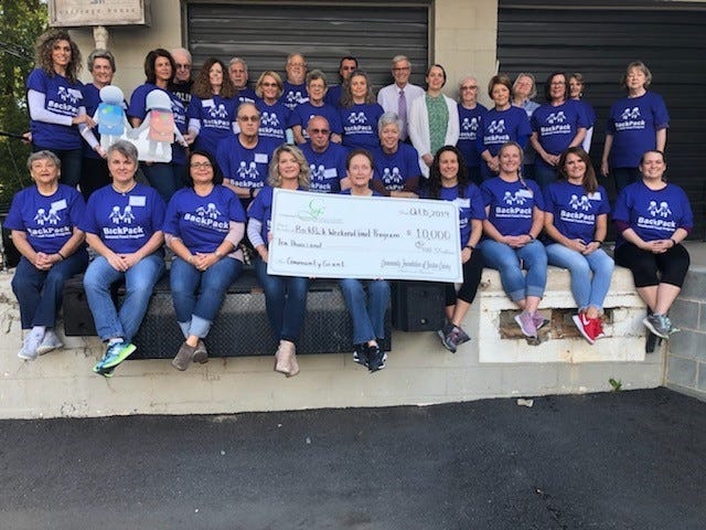 Volunteers with the BackPack Weekend Food Program, Inc. (BWFP) and the Gaston Community Foundation celebrate the awarding of a $10,000 grant to the BWFP from the foundation. [PROVIDED PHOTO]