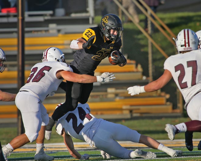 Adrian College running back Colton Randle dives for more yards against Alma. Telegram photo by John Discher
