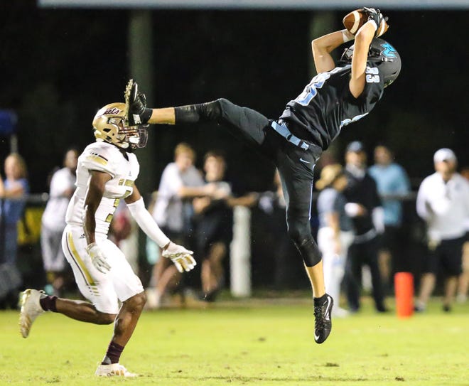 Ponte Vedra wide receiver Alex Madson (83) catches a pass during the second quarter against St. Augustine. [Gary Lloyd McCullough/ Correspondent]