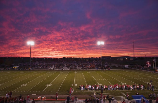 Glenwood seniors line up in front of a colorful sunset for Senior Night recognition before facing off against Rochester at Glenwood High School Friday, Oct. 25, 2019. [Ted Schurter/The State Journal-Register]