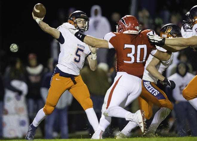 Rochester quarterback Clay Bruno throws downfield at Chatham Glenwood High School on Friday. [Ted Schurter/The State Journal-Register]